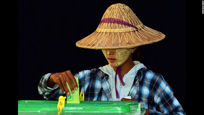 A woman casts her vote in a polling station in Naypyidaw, Myanmar, November 8.
